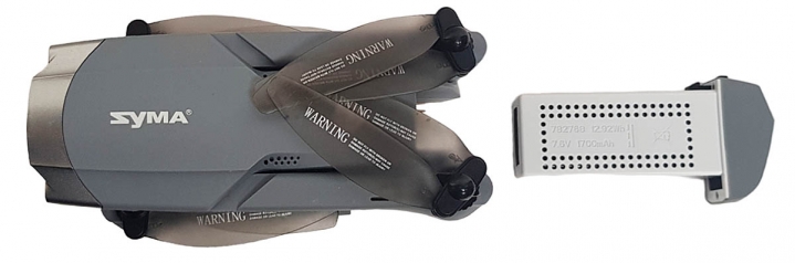 Složený SYMA X30 shora v detailu s akumulátorem... Složený SYMA X30 shora v detailu s akumulátorem...